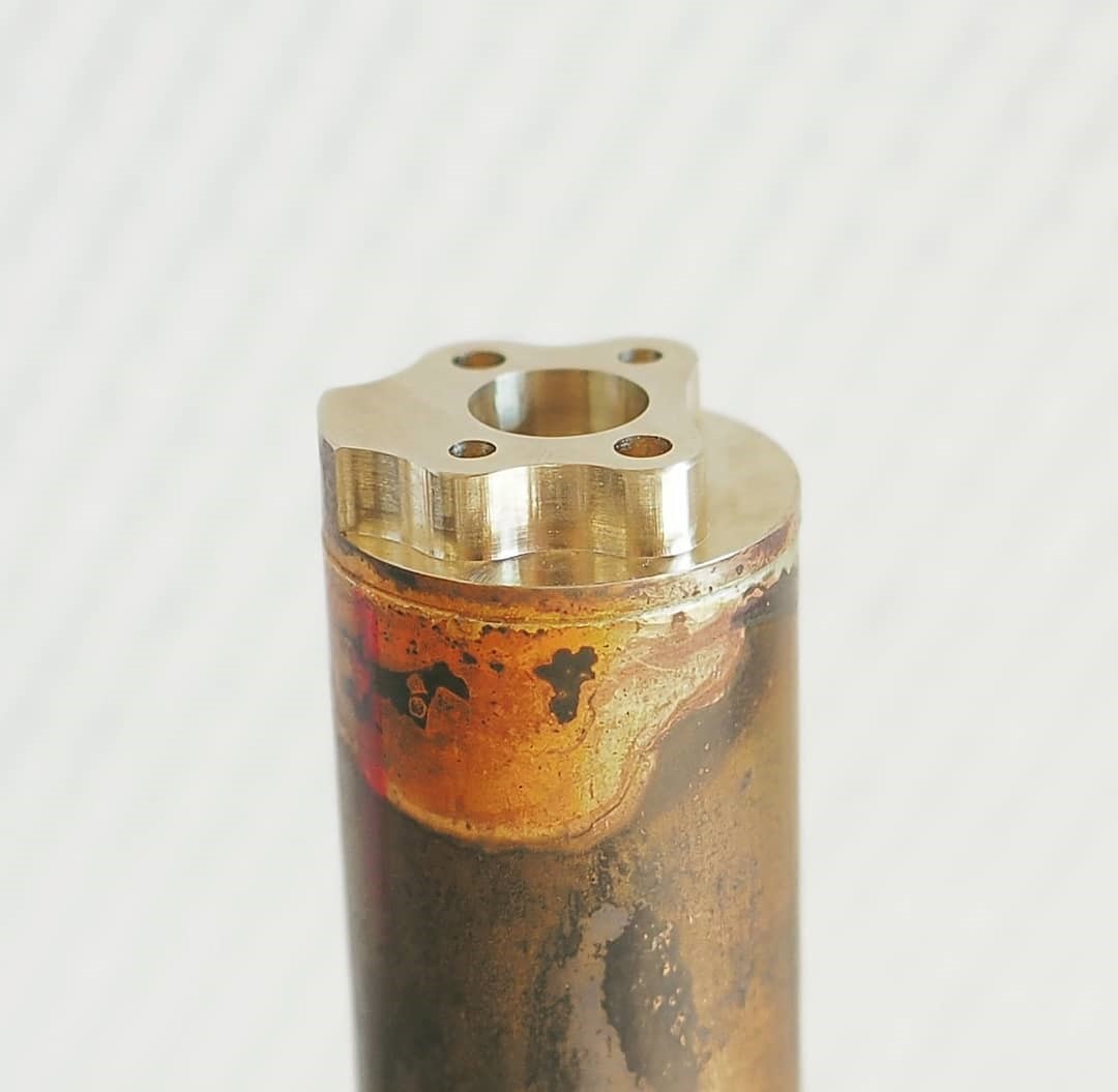 Two components of the cylinder after silver soldering